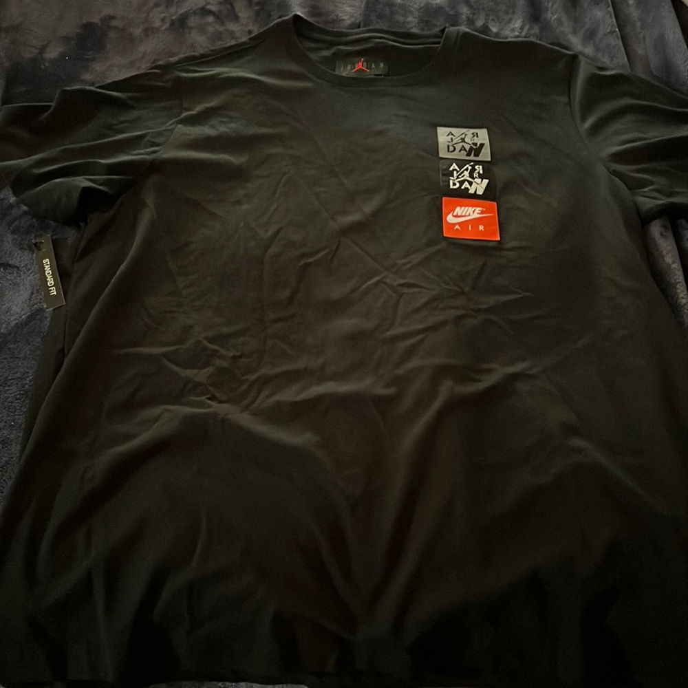 XL BLACK JORDAN TEE WITH PATCHES ON LEFT SIDE OF CHEST STANDARD FIT